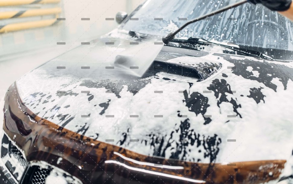 demo-attachment-76-op_carwash-service-car-cleaning-top-view-on-hood-NXERU2A