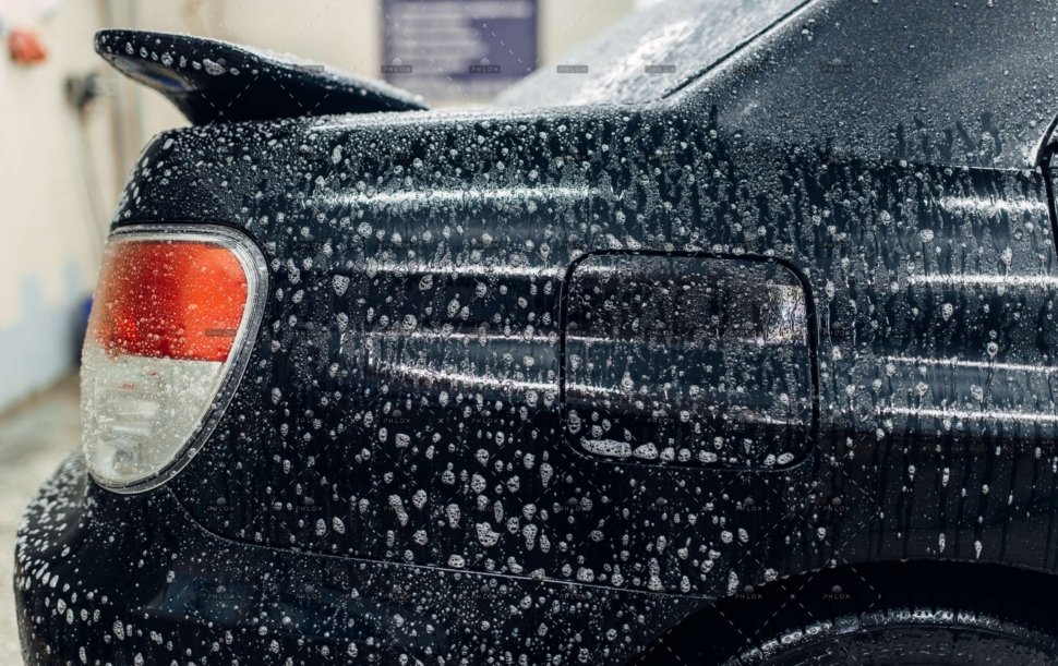 demo-attachment-996-op_carwash-service-car-in-foam-side-view-Q4VTD8M